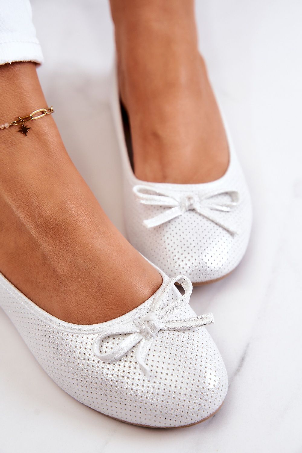 Elegant metallic ballerina flats by Step in Style, featuring a soft natural leather insole and charming bow, perfect for both casual and formal occasions.