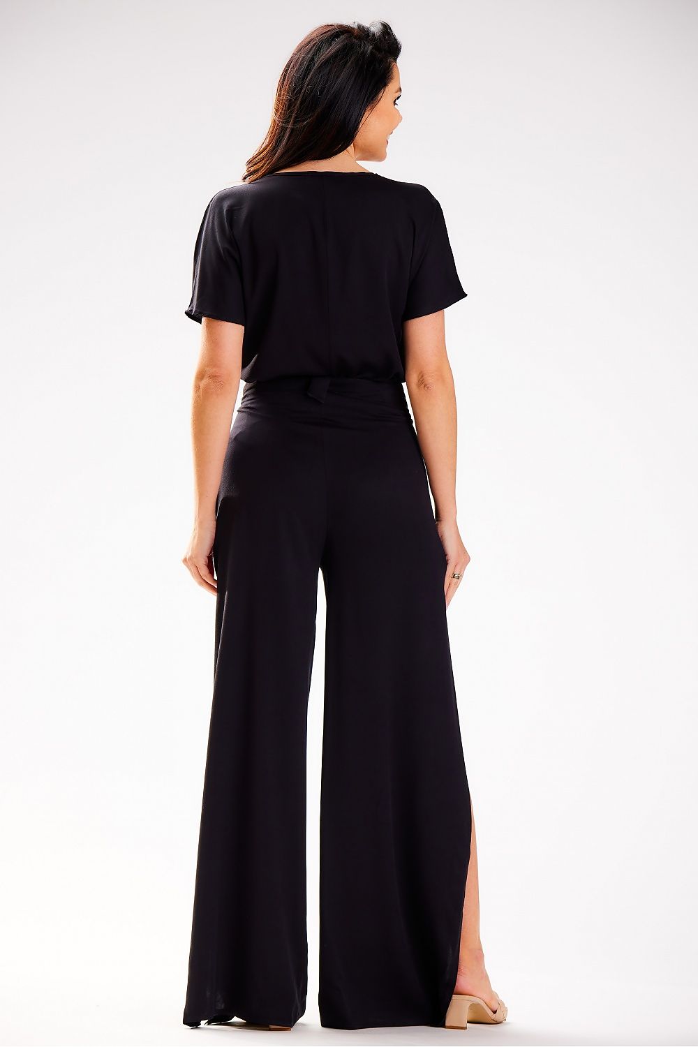 Stylish high-waisted trousers for women by awama, featuring a tiered silhouette in luxurious airy viscose, presented against a soft pastel backdrop.