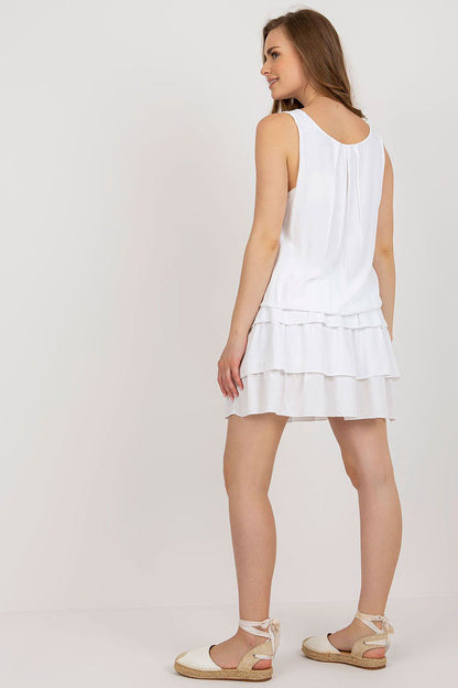 Beautifully arranged image of the Och Bella summer dress, showcasing its round neckline and delicate ruffle details.