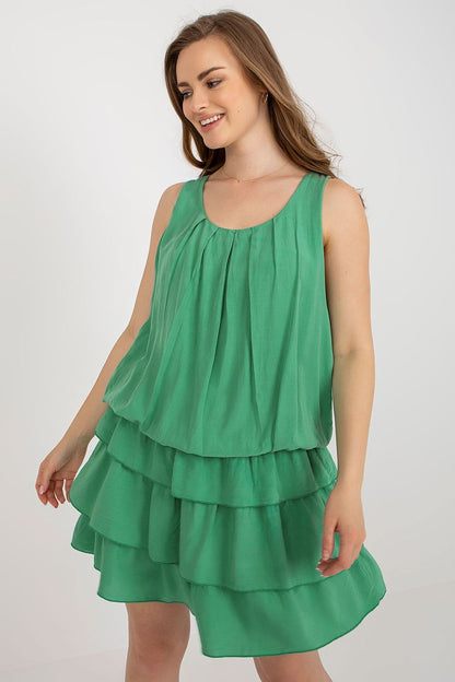 Model wearing the elegant Och Bella sleeveless viscose summer dress, perfectly styled for a luxury summer outing.