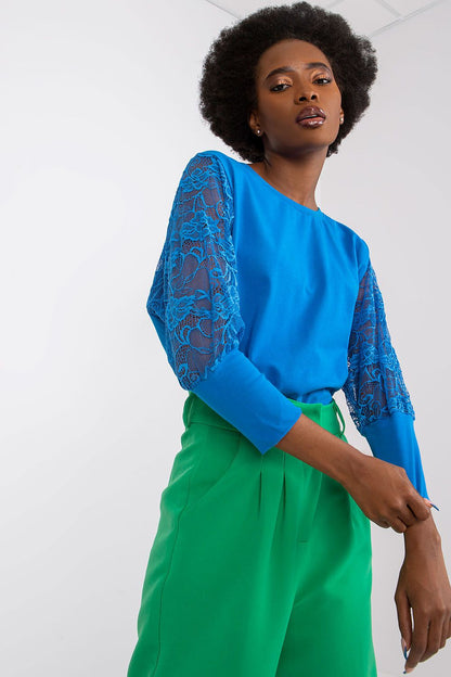 Sophisticated Rue Paris blouse in a comfortable cotton-spandex mix, featuring a delicate round neckline and stylish lace sleeves.