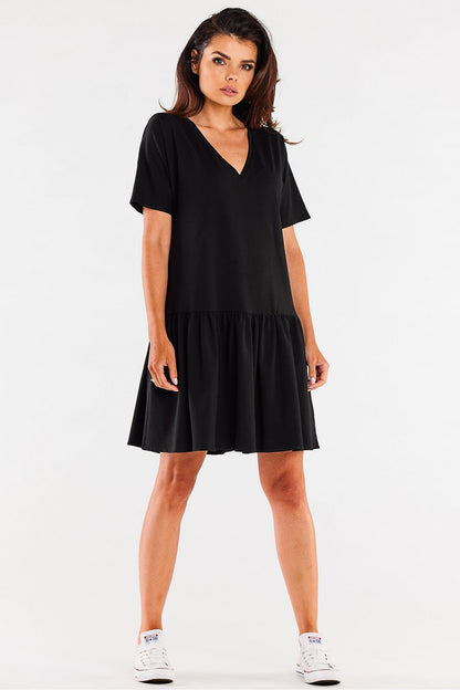 The Infinite You Cotton Ruffle Daydress displayed on a mannequin, emphasizing its comfortable silhouette and soft cotton fabric ideal for warm weather.