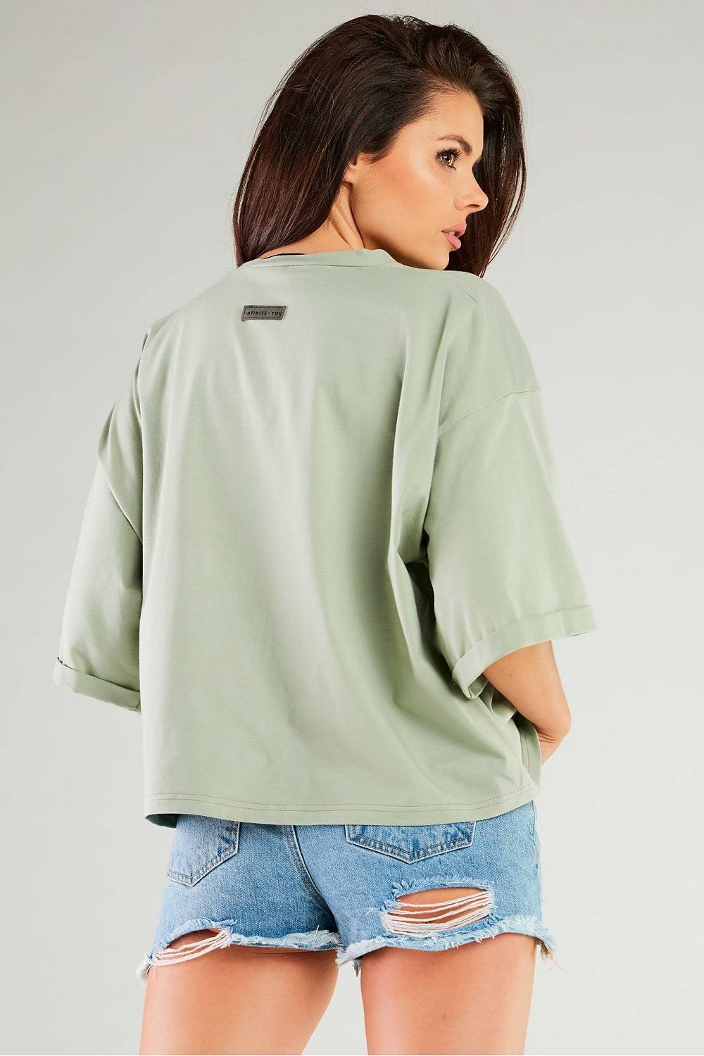 Chic loose blouse with wide sleeves by Infinite You, modelled in classic black.