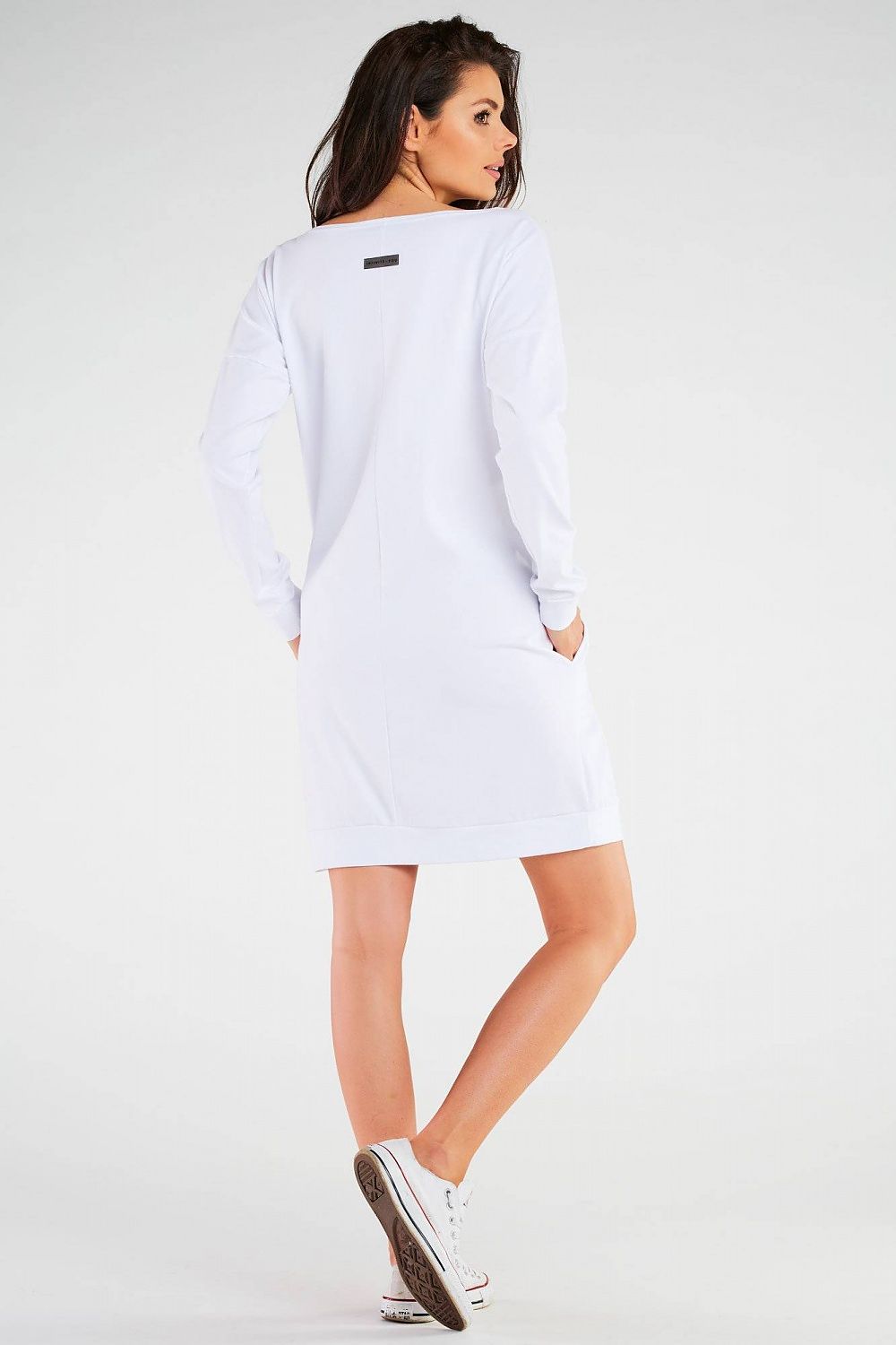 Model wearing the Infinite You long sleeve daydress, highlighting its flattering silhouette and soft fabric blend, ideal for casual outings.