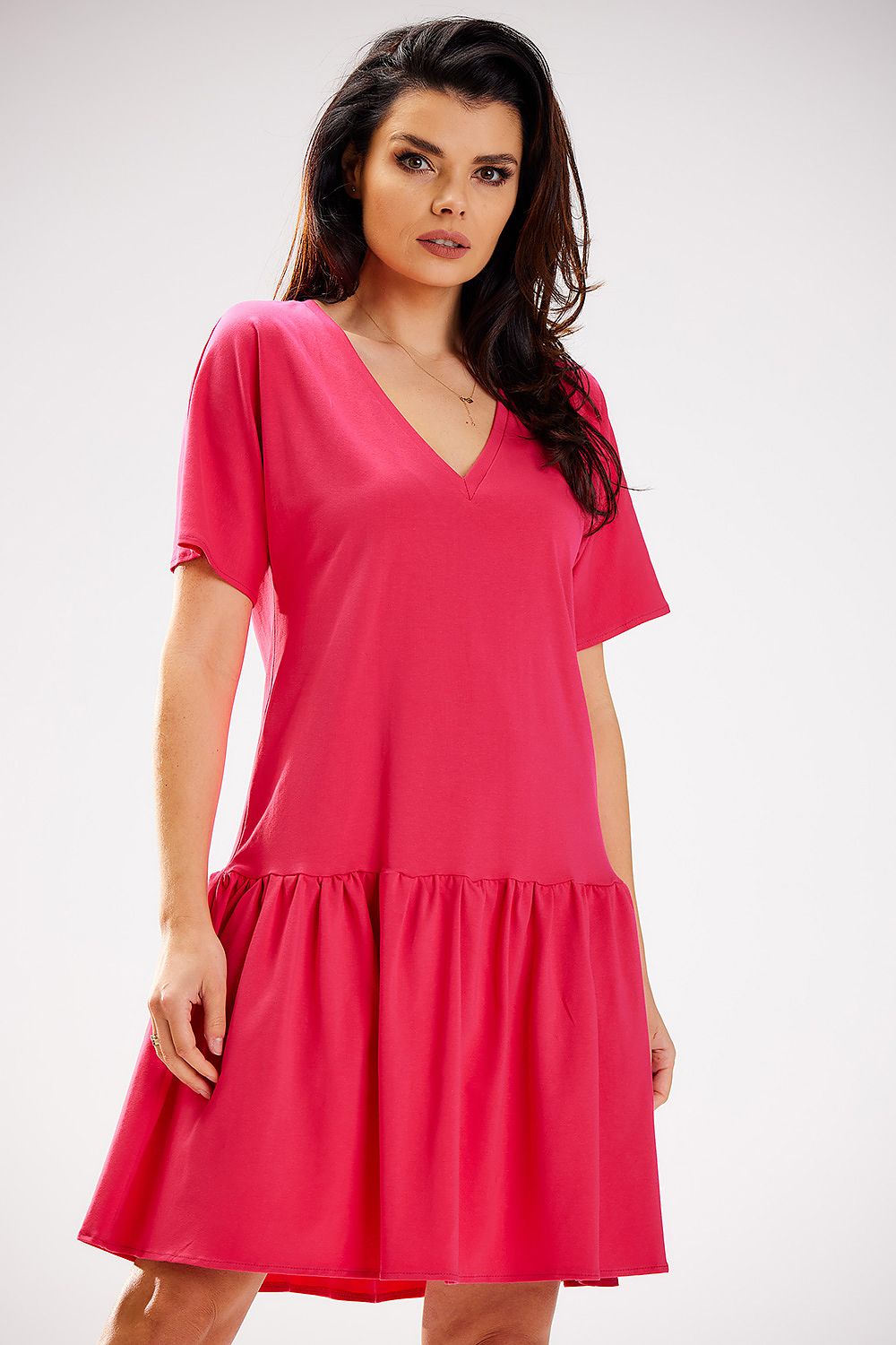 Model wearing the Infinite You Cotton Ruffle Daydress, exuding comfort and style with its loose fit and flattering design suitable for various occasions.