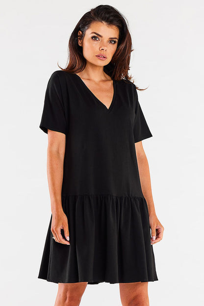 Versatile styling of the Infinite You Cotton Ruffle Daydress with casual sneakers, showcasing its flexibility for both relaxed and dressed-up occasions.