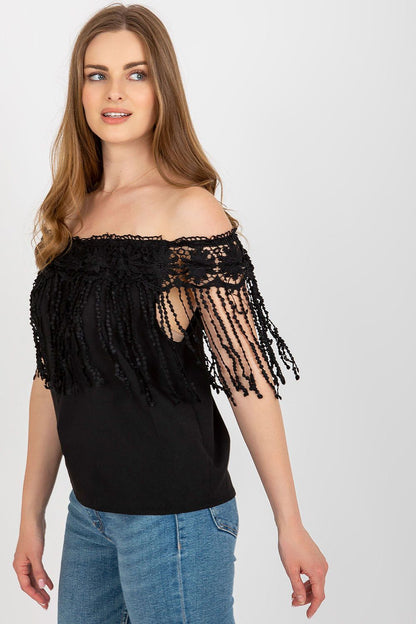 Elegant summer blouse by AT featuring a Spanish-style neckline and intricate lace trim, perfect for a luxurious summer look.