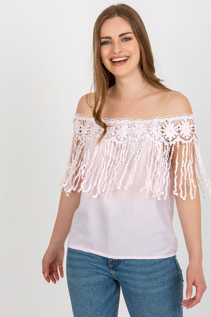 Model wearing the elegant summer blouse by AT with a Spanish-style neckline, ideal for summer fashion and casual outings.