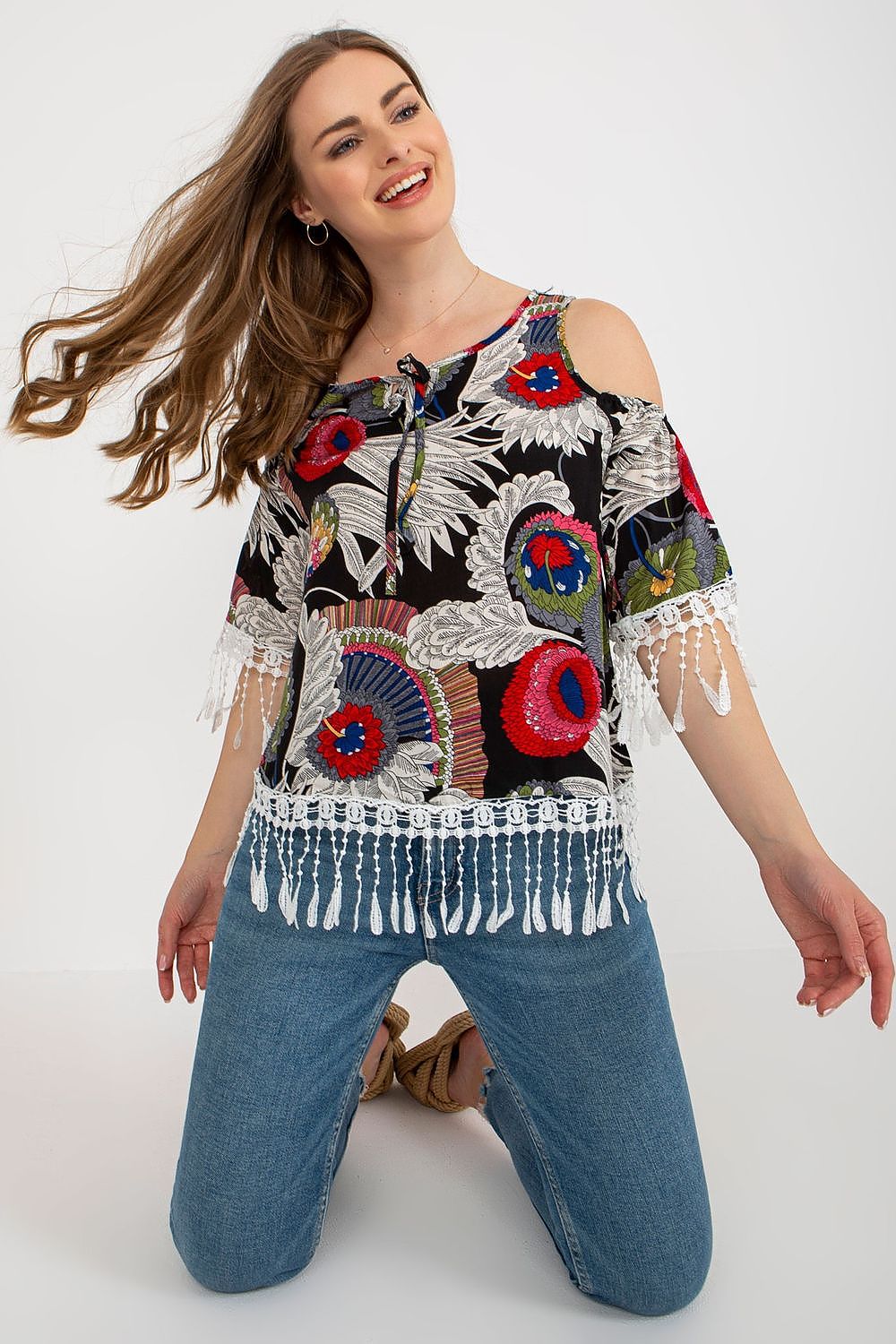 Luxury printed summer blouse by AT featuring 3/4 sleeves, round neckline, and decorative tassels on a vibrant fabric.