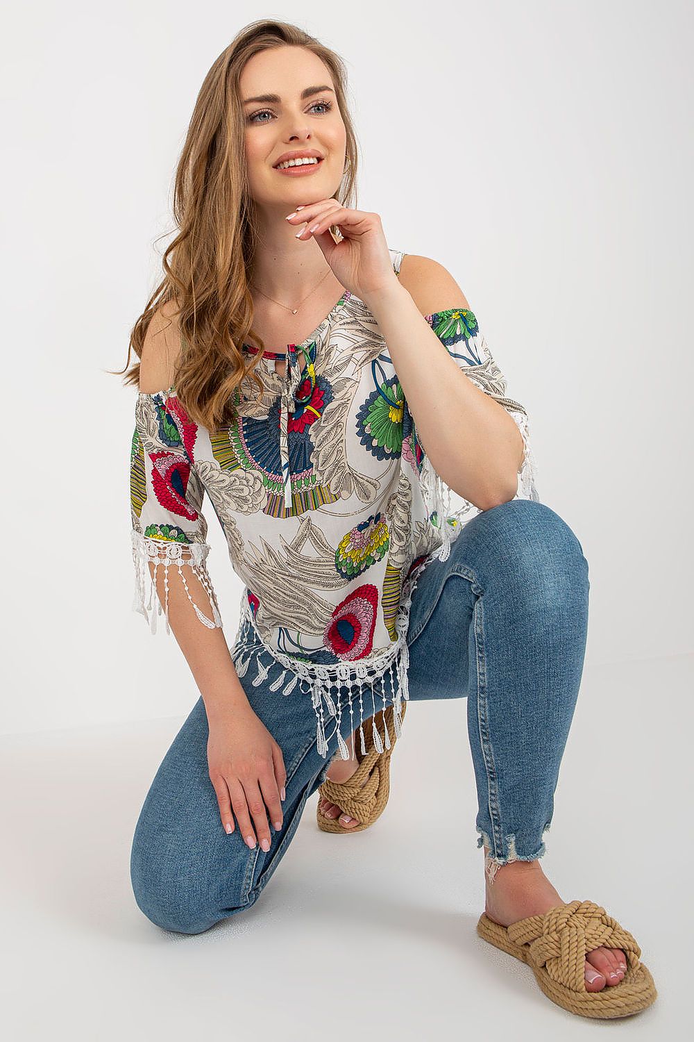 Elegant luxury printed summer blouse by AT featuring 3/4 sleeves, a round neckline, and decorative tassels.