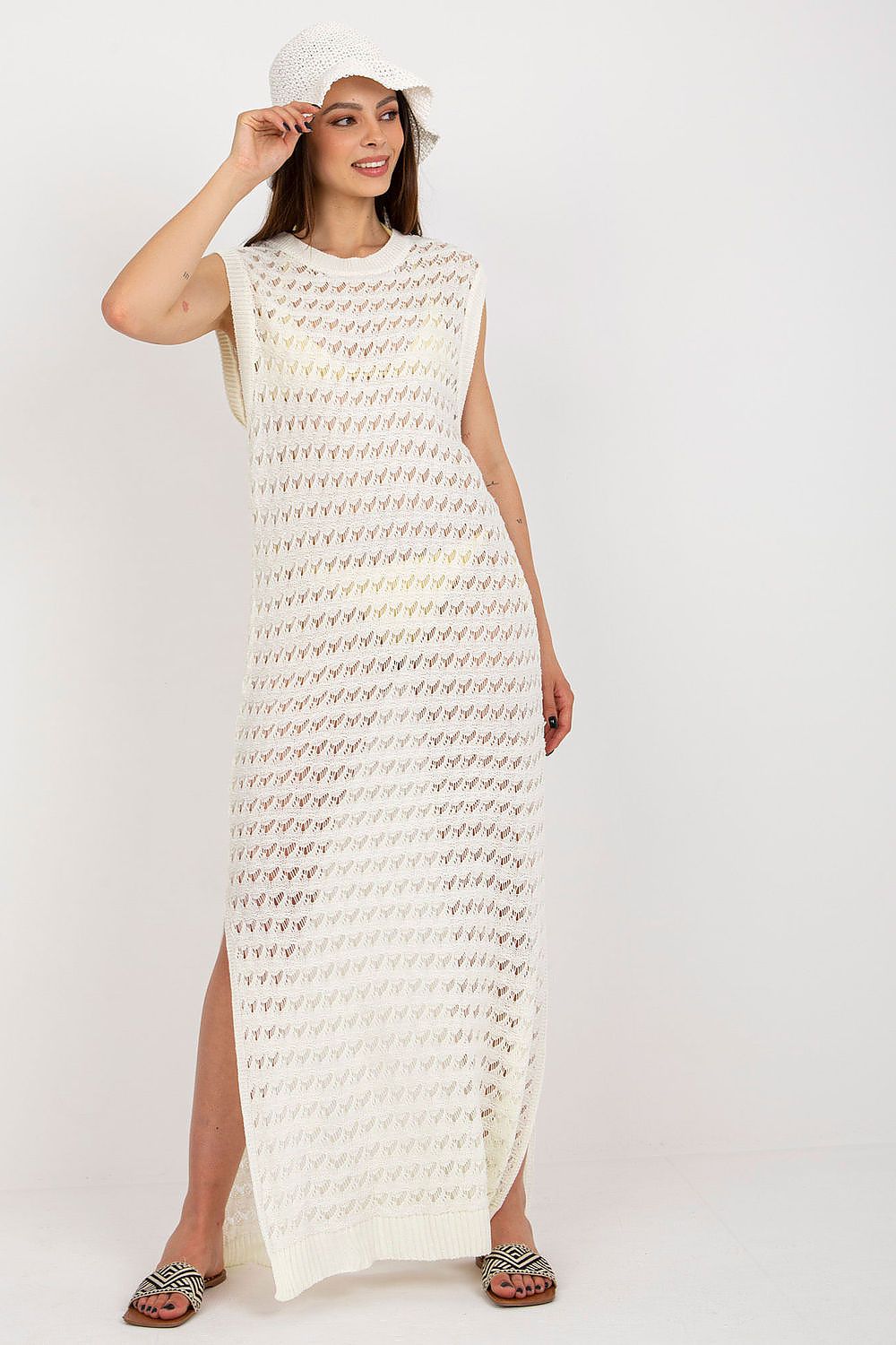 Luxury Openwork Long Knit Beach Dress by Badu featuring decorative side slits, ideal for beach outings and elegant summer occasions.