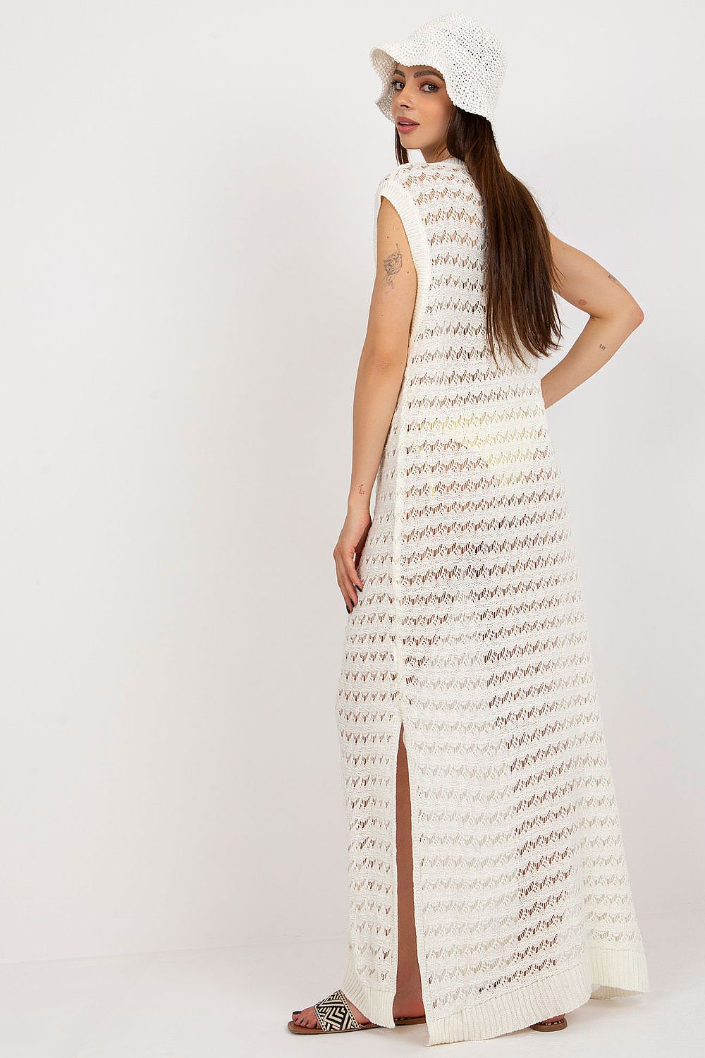 Close-up of luxury openwork detailing on the Badu long knit beach dress, showcasing the fine acrylic and wool blend.