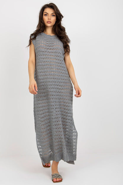 Luxury openwork long knit beach dress by Badu, featuring decorative side slits, perfect for summer outings.