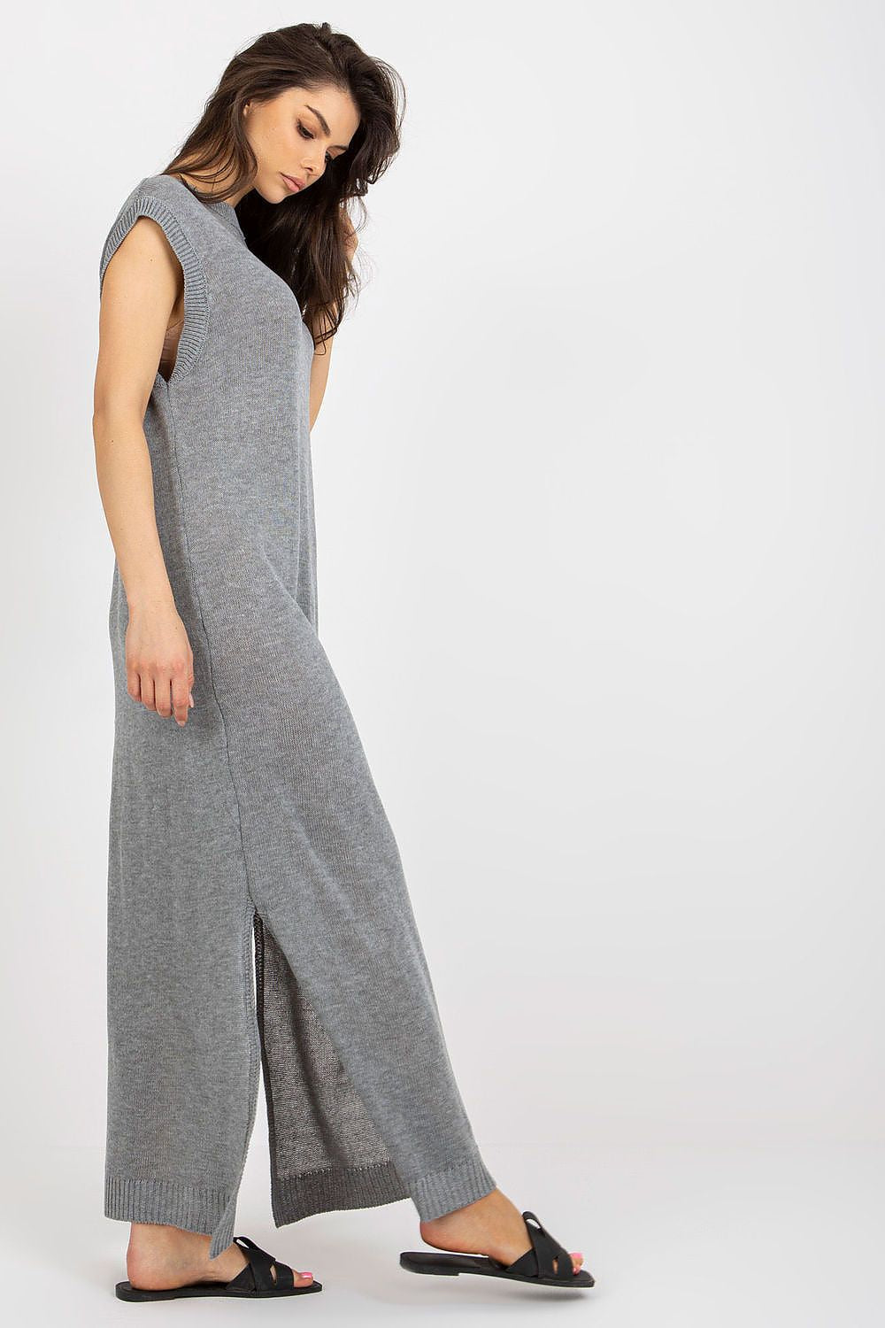 Luxury long knit beach dress with decorative side slits by Badu, showcasing effortless summer elegance.