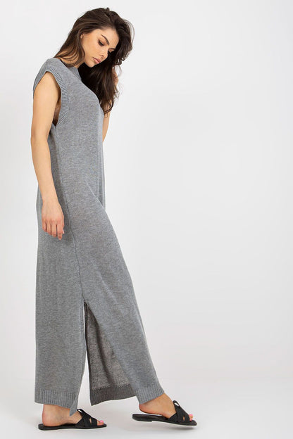 Luxury long knit beach dress with decorative side slits by Badu, showcasing effortless summer elegance.