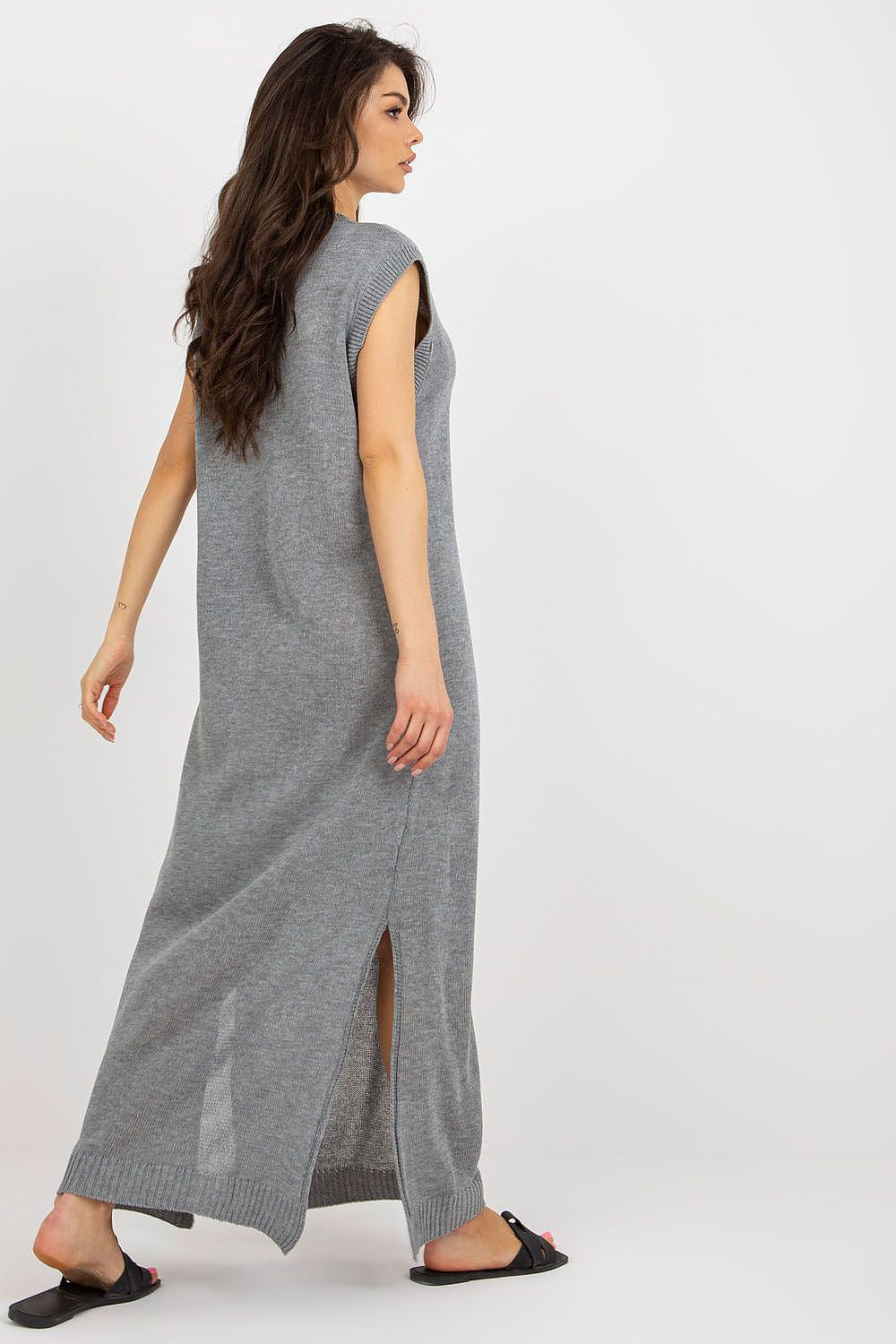Badu's chic long knit dress featuring stylish side slits, perfect for beach outings and summer events.