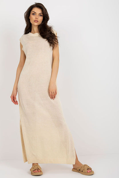 Stylish long knit beach dress by Badu with intricate side slits, epitomizing luxury summer fashion.