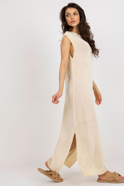 Elegant long knit dress by Badu, designed with beautiful side slits for a sophisticated summer look.
