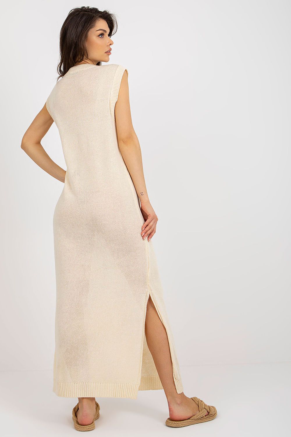 Badu luxury long knit beach dress highlighting decorative side slits, an ideal choice for summer style.