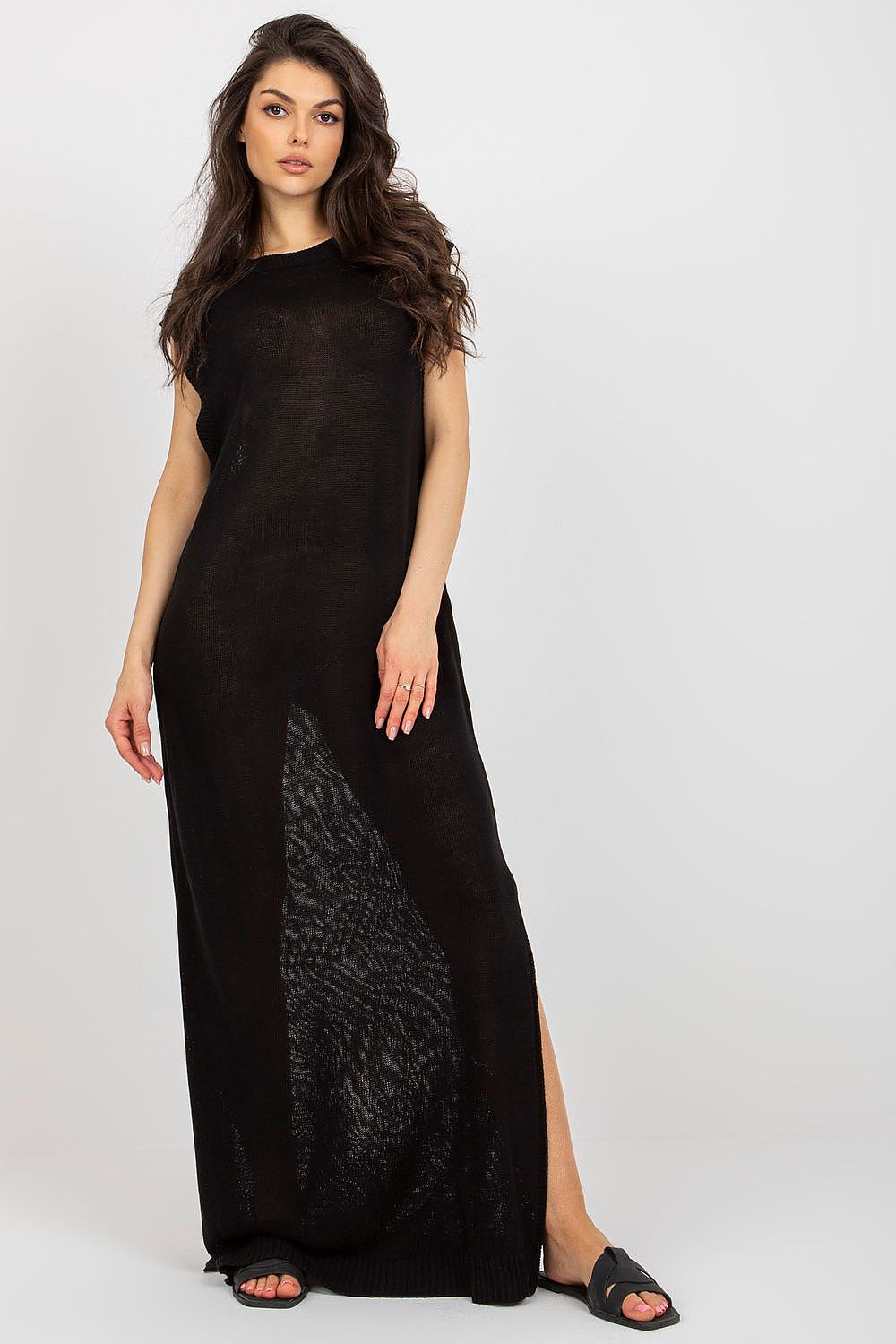 Luxury long knit beach dress with decorative side slits by Badu, showcasing a chic summer style.
