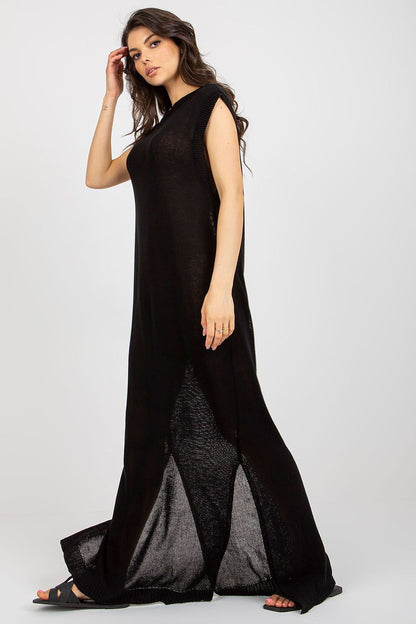 Elegant close-up of the side slits on Badu's luxury long knit beach dress, perfect for a fashionable summer ensemble.