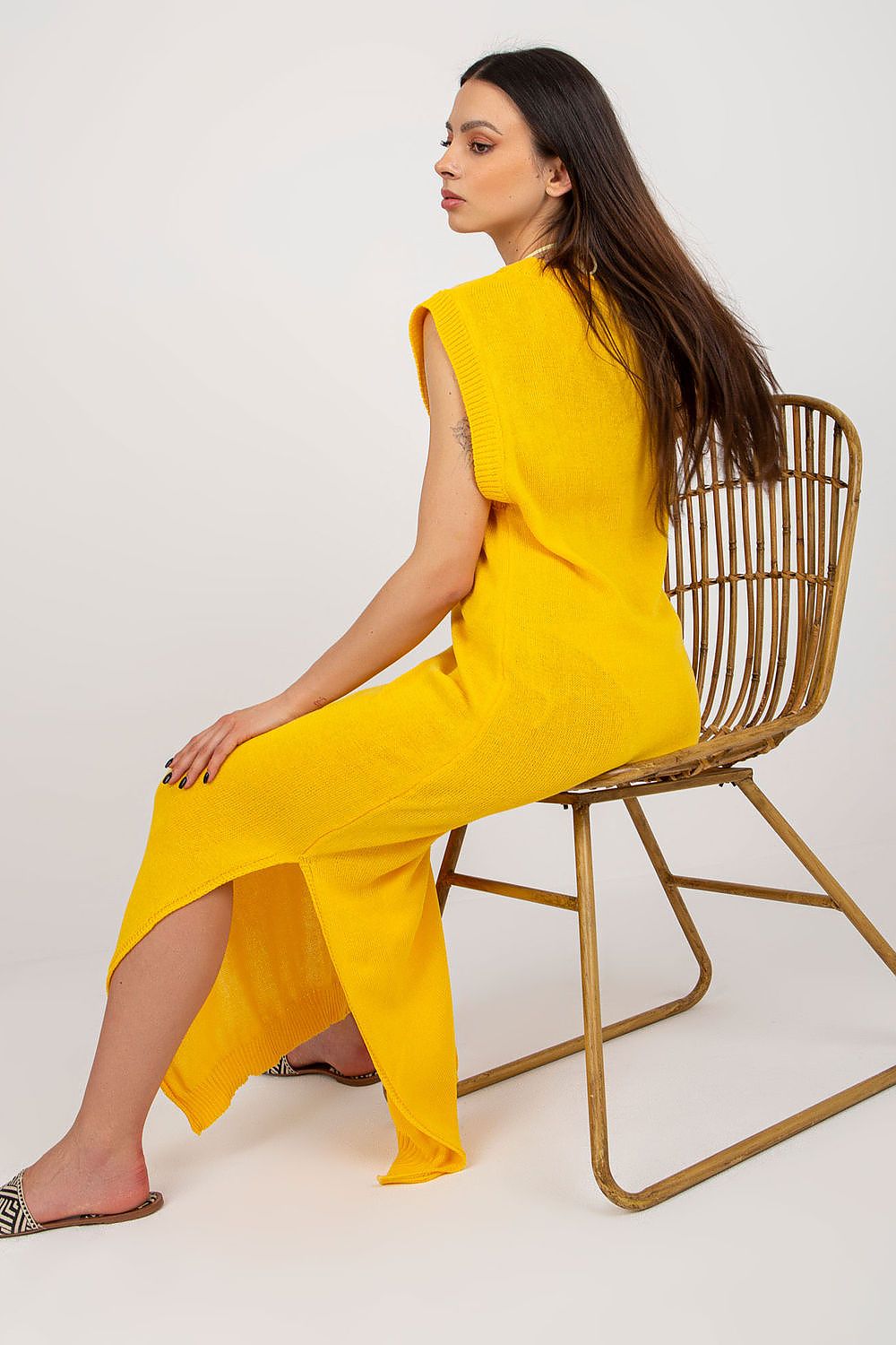 Luxurious long knit beach dress with decorative slits by Badu, perfect for summer days at the beach.