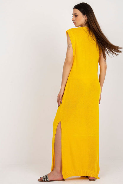 Elegant sleeveless beach dress with stylish side slits, crafted by Badu for a chic summer look.