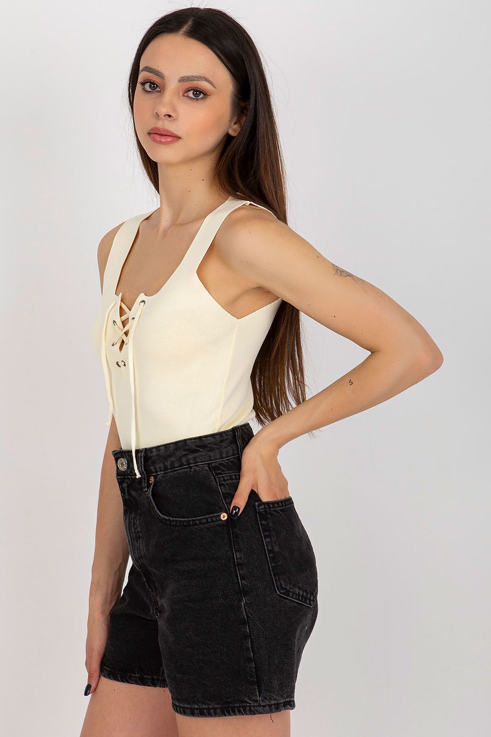 Badu's luxurious summer t-shirt in EU size 0, showcasing a chic strapless design and sophisticated laced neckline for a fashion-forward look.