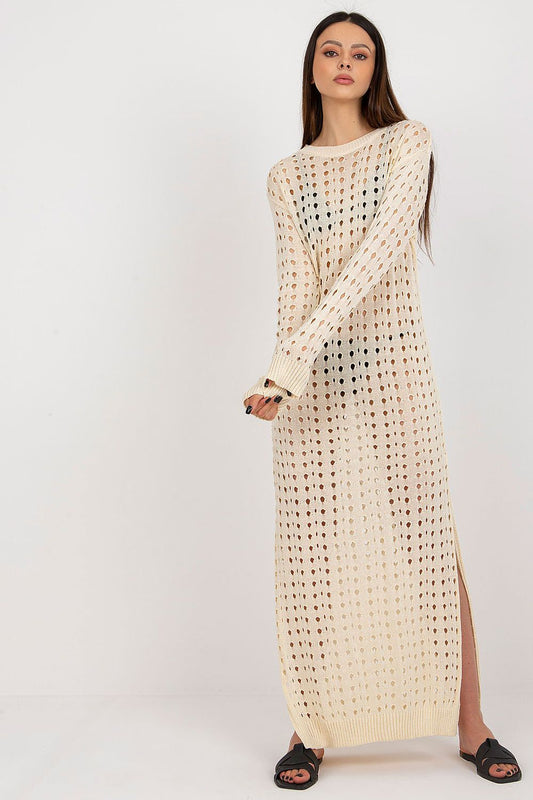 Elegant Badu openwork long knit beach dress featuring decorative slits and long sleeves, perfect for a luxurious summer outing.