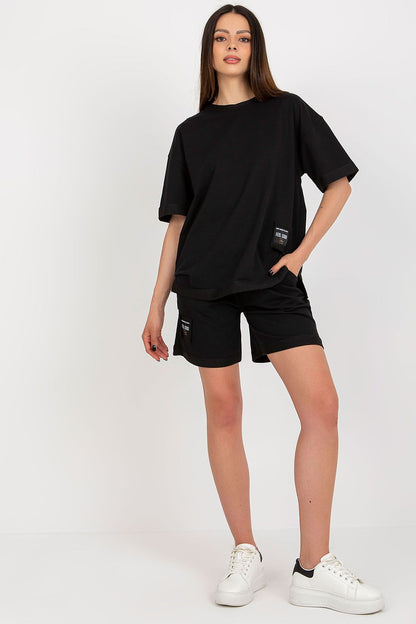 Stylish Badu Women's Cotton Set flat lay showcasing the blouse and shorts with intricate decorative patches, perfect for refined casual wear.