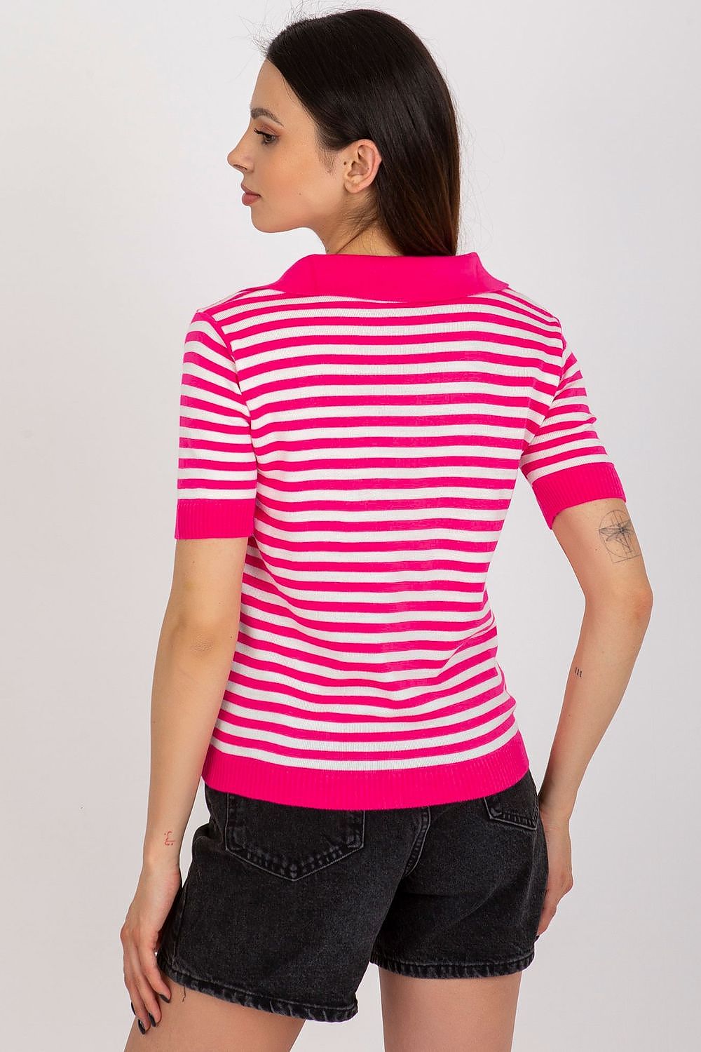 Model wearing Badu's luxury striped knitted blouse, demonstrating the perfect EU size 0 fit, styled with chic accessories for a complete upscale outfit.