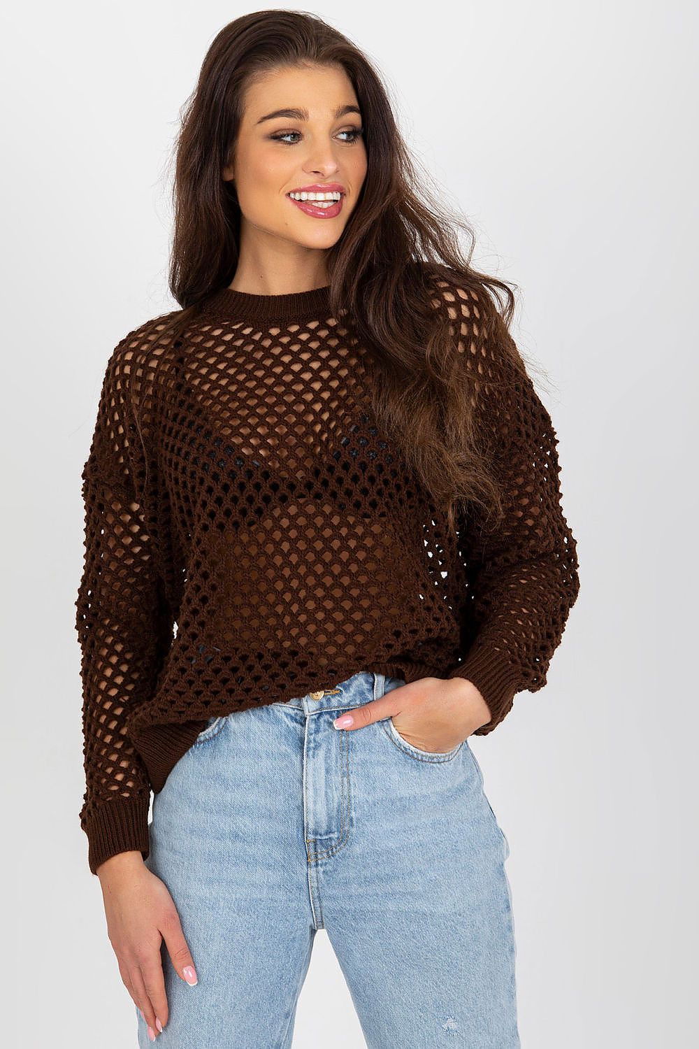 Model wearing the Badu summer openwork women's sweater, capturing the essence of summer fashion with a beautiful openwork design and luxurious fabric.