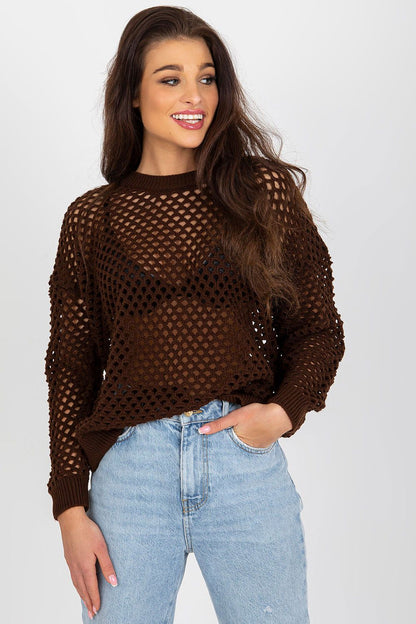 Model wearing the Badu summer openwork women's sweater, capturing the essence of summer fashion with a beautiful openwork design and luxurious fabric.