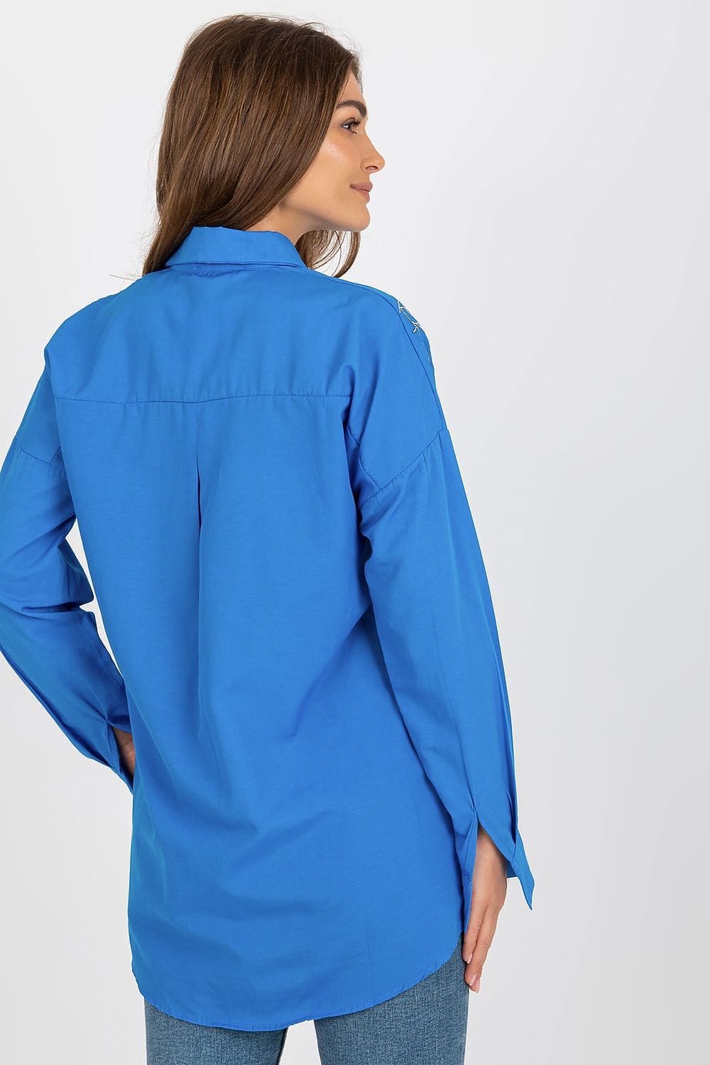 Stylish luxury women's long sleeve buttoned shirt showcased on a mannequin, highlighting its loose fit and embroidered details. Find it at Factory Price.