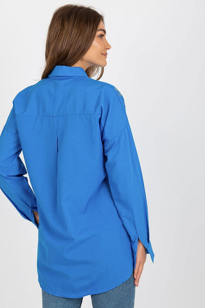 Stylish luxury women's long sleeve buttoned shirt showcased on a mannequin, highlighting its loose fit and embroidered details. Find it at Factory Price.