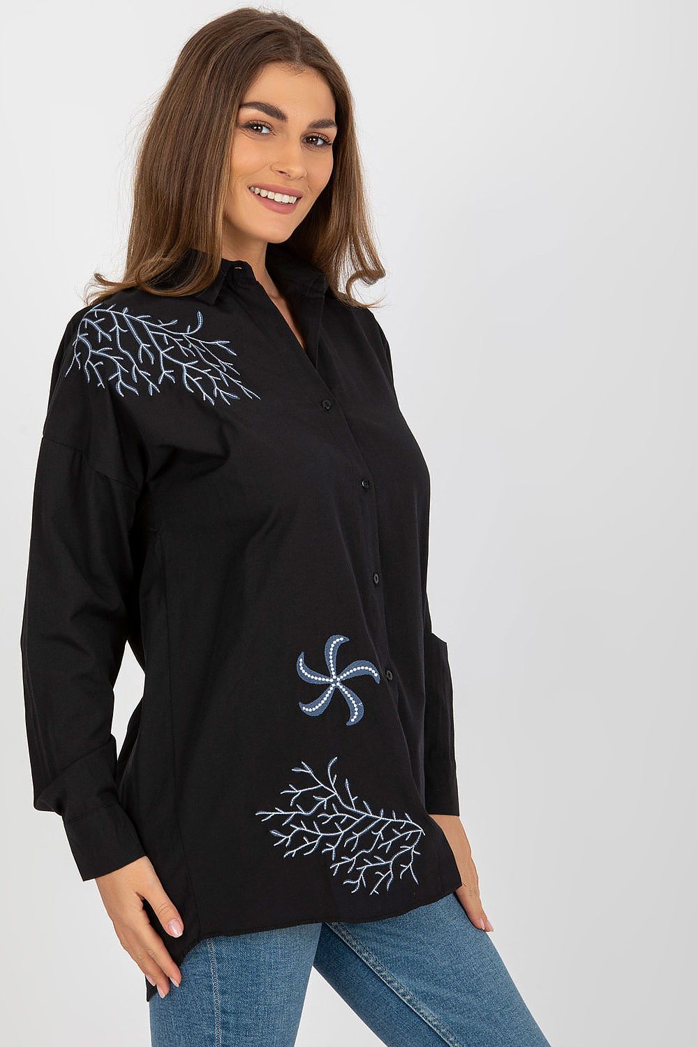 Detailed view of unique embroidery on Luxury Women's buttoned shirt designed by Factory Price, highlighting intricate patterns.