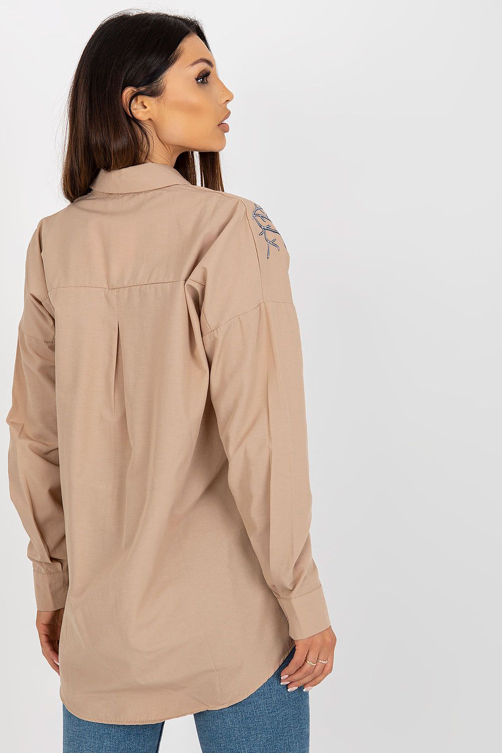 Model wearing a Luxury Women's long sleeve buttoned shirt with unique embroidery, created by Factory Price, demonstrating versatile styling.