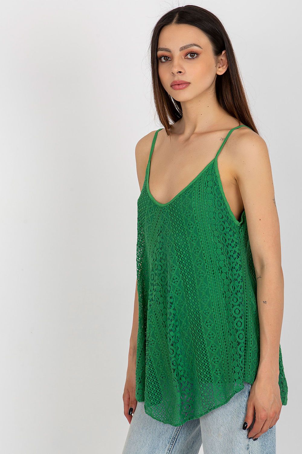 Detail of the exquisite lace pattern on an Och Bella v-neck top, ideal for luxury summer fashion.