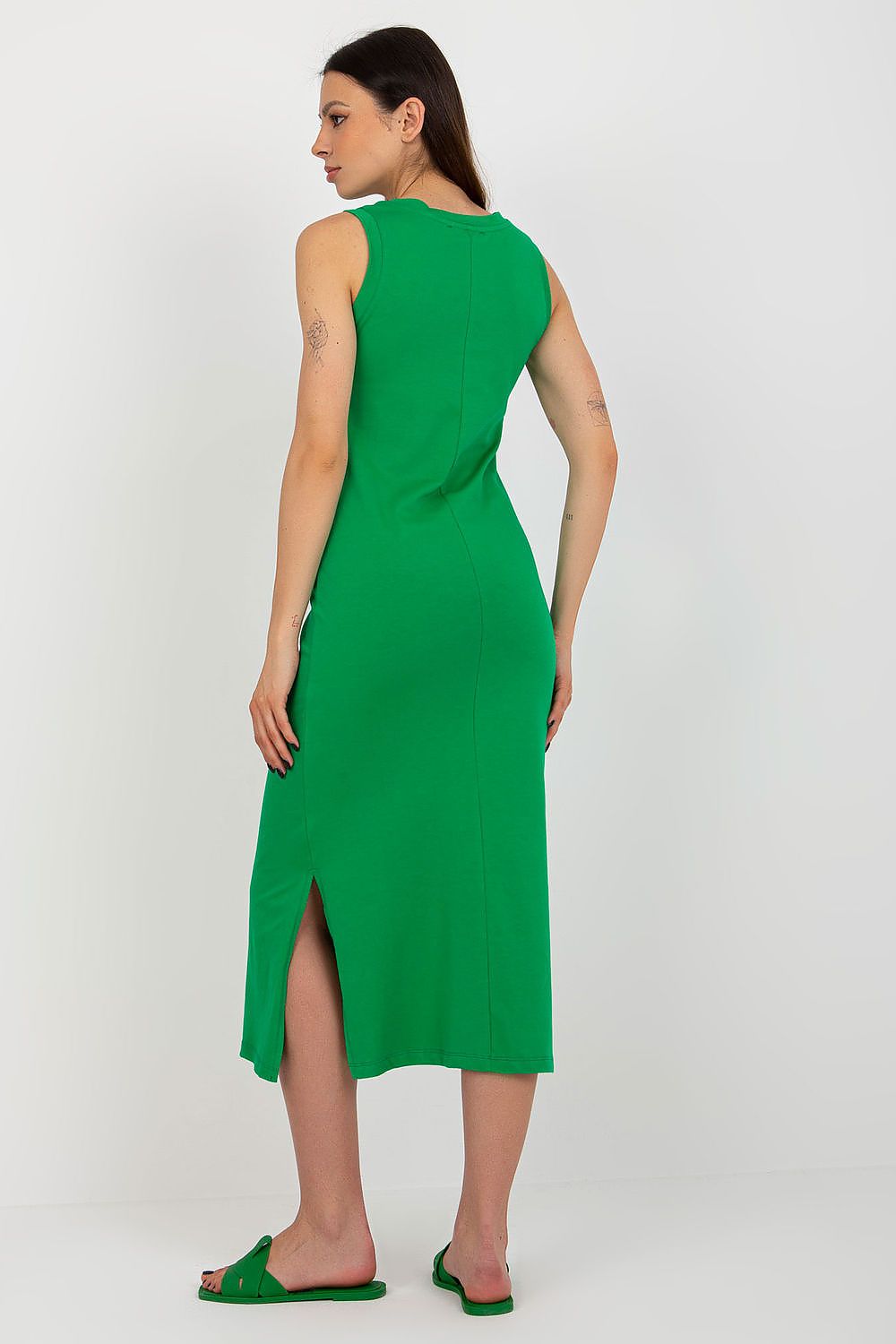 Stylish side view of Och Bella's sleeveless cotton dress featuring elegant slits, ideal for sophisticated summer styling.