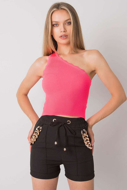 Model wearing Calben's stylish one shoulder ribbed acrylic top, exuding elegance and charm in a casual setting.