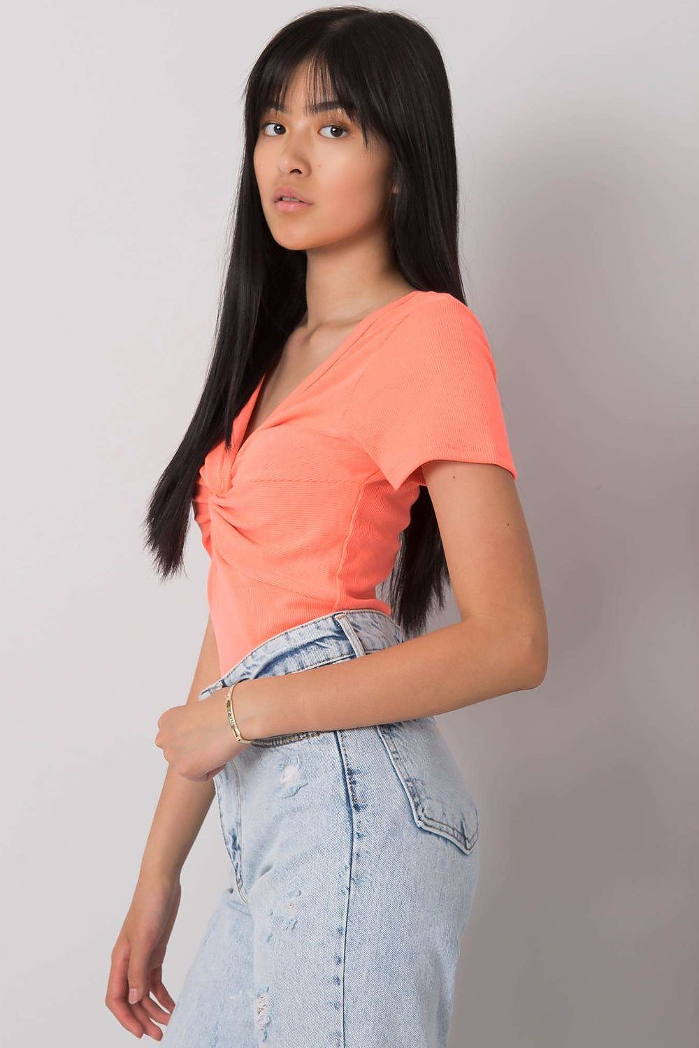 Flat lay of Calben's luxurious short sleeve blouse featuring a decorative knot and heart neckline, emphasizing its high-quality ribbed fabric.