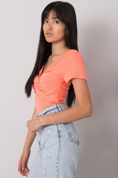 Flat lay of Calben's luxurious short sleeve blouse featuring a decorative knot and heart neckline, emphasizing its high-quality ribbed fabric.