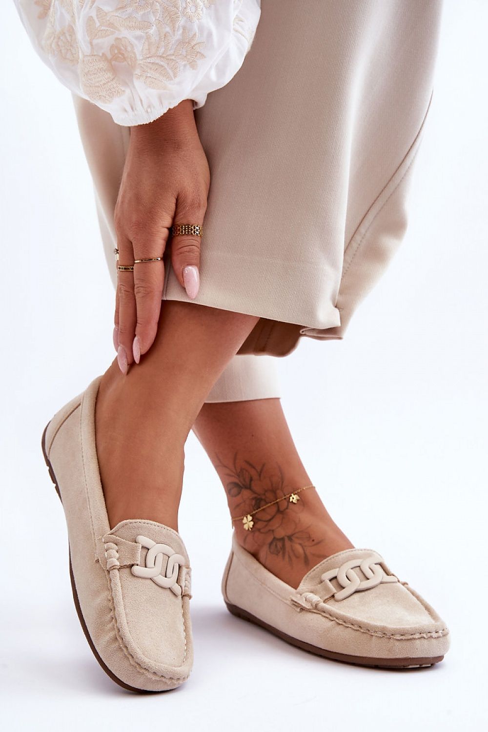 Elegant women's eco-suede moccasins by Step in Style featuring a chic decorative accent and luxurious non-slip sole for comfort and style.