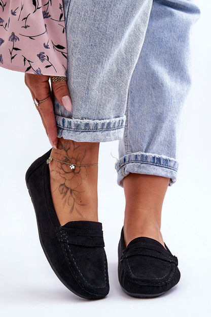 Step in Style's elegant women's moccasins made of eco-suede, showcasing a stylish strap and a comfortable non-slip sole, perfect for effortless luxury.