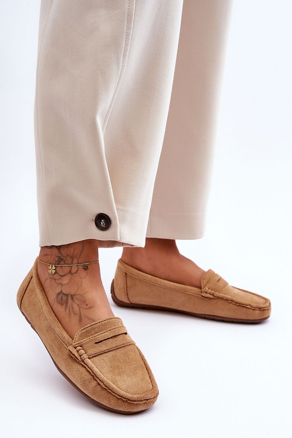 Luxury women's moccasin footwear by Step in Style, crafted from eco-friendly suede with intricate perforated details for breathability.