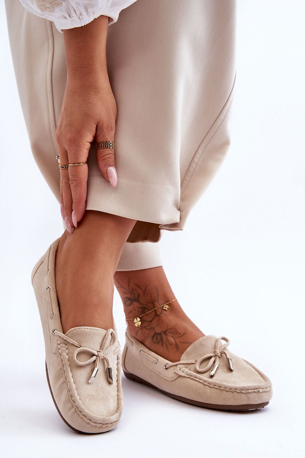 Elegant eco-suede moccasins from Step in Style, designed with a stylish bow and comfortable non-slip sole, perfect for chic footwear collections.