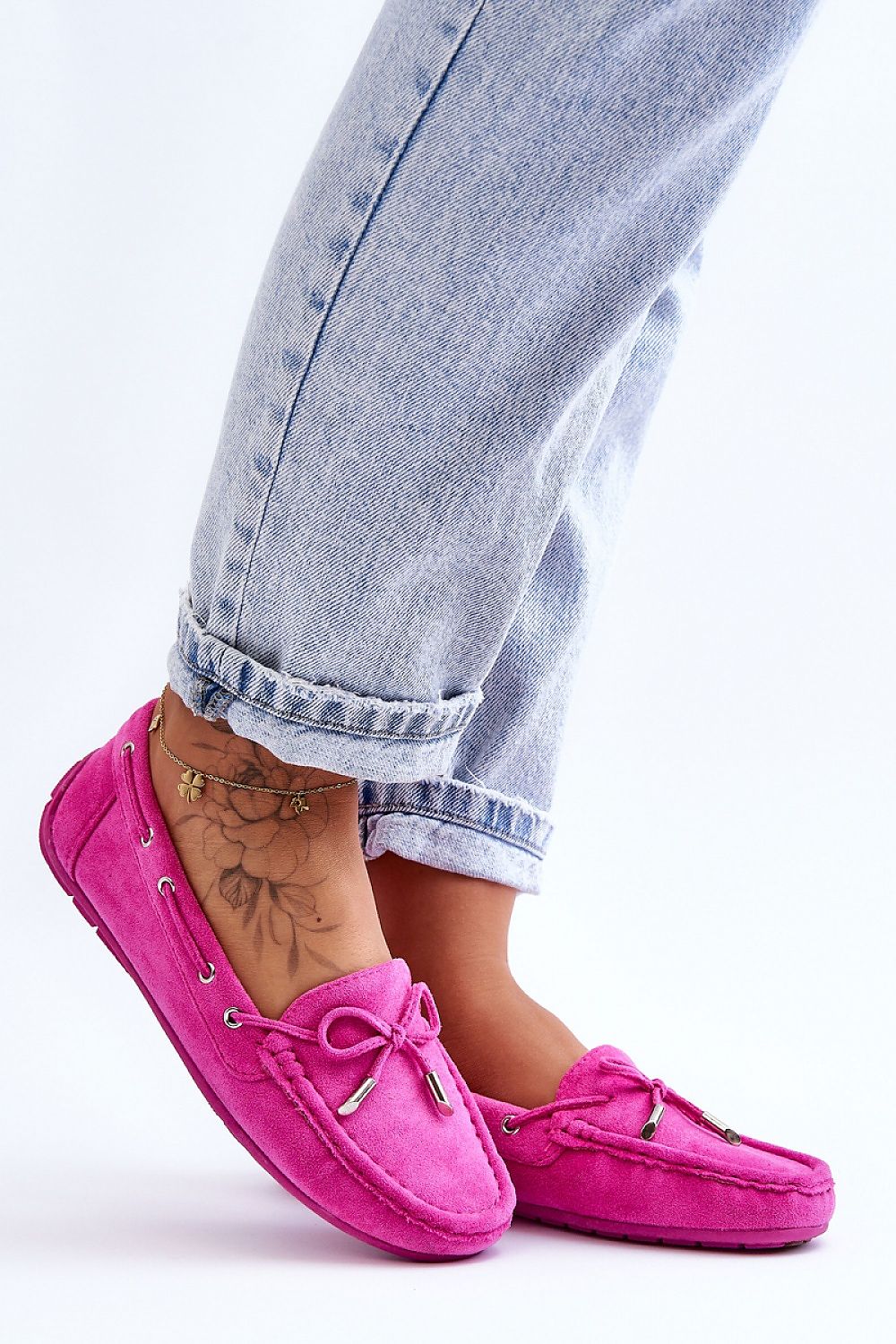 Close-up of the stylish decorative bow on women's eco-suede moccasins by Step in Style, highlighting exquisite craftsmanship.