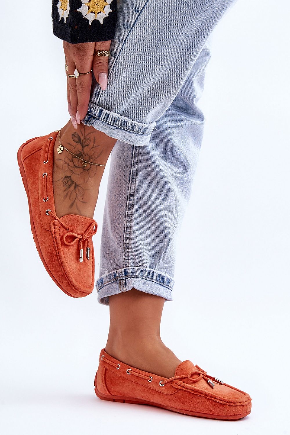 Stylish eco-suede moccasins for women by Step in Style, featuring intricate bow detailing and comfortable non-slip sole for fashionable comfort.