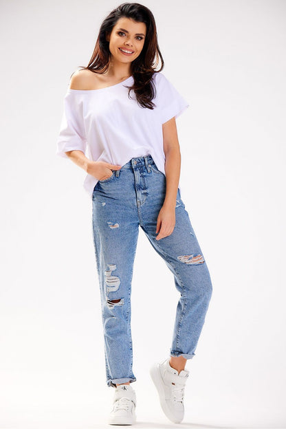 Model wearing the Luxury Loose T-Shirt by Infinite You, demonstrating how the deep boat neckline can be styled off the shoulder.