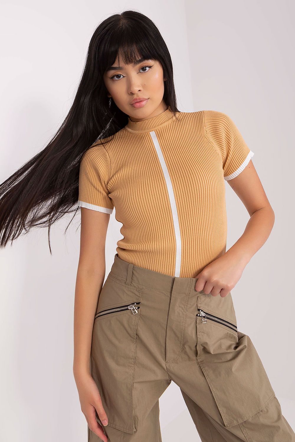 The Badu ribbed blouse styled with a half turtleneck, exemplifying modern elegance and comfort for daily wear.